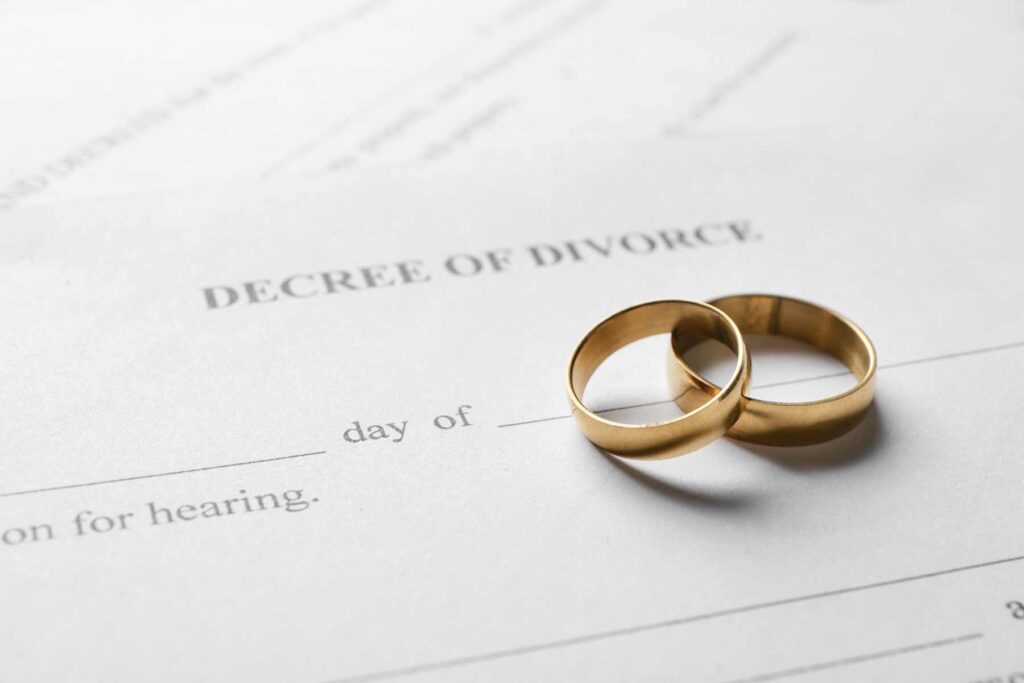 Irretrievably broken Divorce Papers with relinquished wedding rings