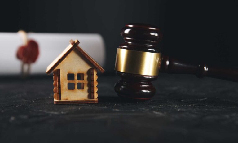 picture of a toy house, money, and a judge's gavel, representing complex divorce attorney
